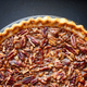 Pecan pie on black background